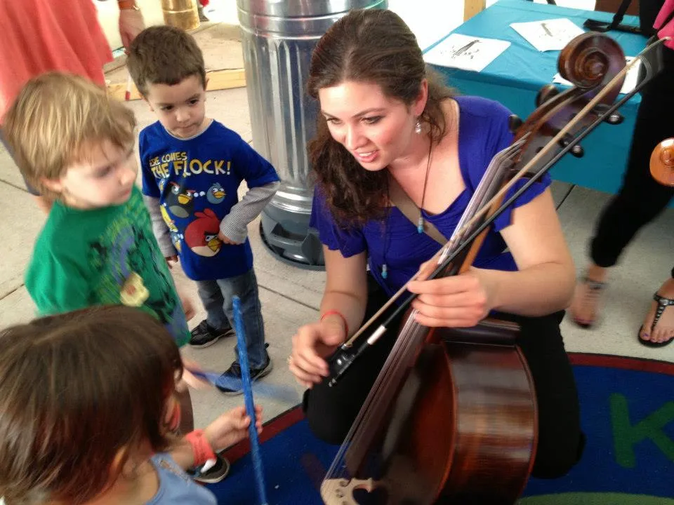 Cecilia teaching young cellists